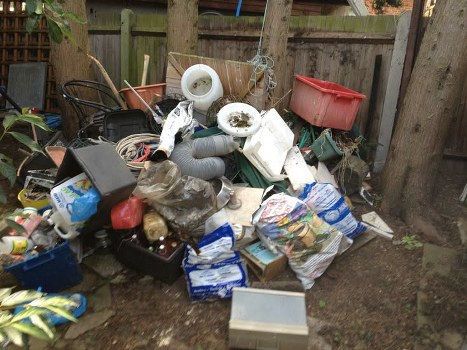 Waste clearance truck transporting building materials